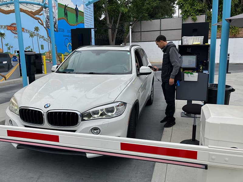 QuikWash team member helping a customer